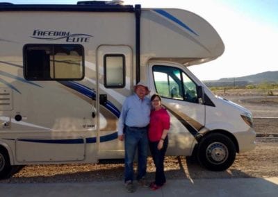 happy couple with class c motorhome rental